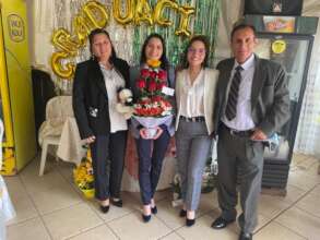 Thilcia with her family following her graduation.