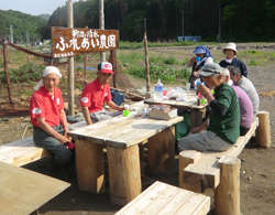 Residents gathered around a table to take a break