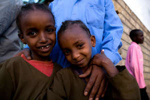 Ililhan (L) and cousin Katra smile at the camera