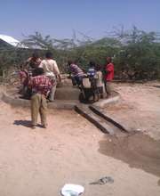 Children fetching water from a rehabilitated well