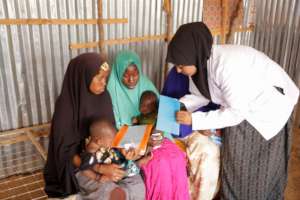 Our nurse speaks with women at Kaxda Health Center