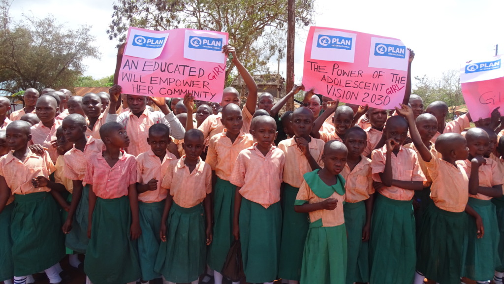 Girls raise their voices in a peaceful procession