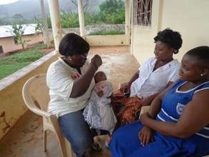 Jenny with her healthy son, her mother and Maggie.