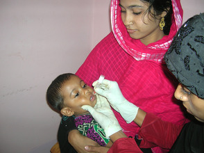Child receiving mircronutrient supplement