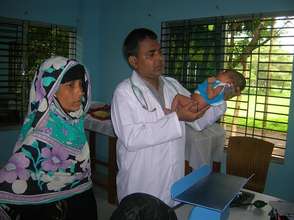Dr. Mizan treating an infant patient