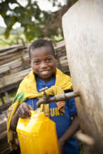 Boy collecting clean water