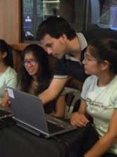 Penguin staff guides students through coding