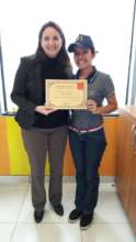 Ruth receiving her best employee certificate