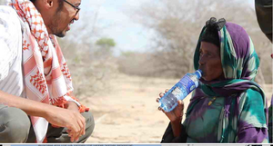 Aato & refugee, walked 22 km, 90 km more to Dadaab
