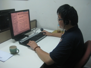 A member of staff recording a DAISY book