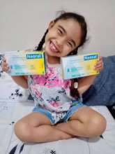 Brielle with life saving medicines in May 2020