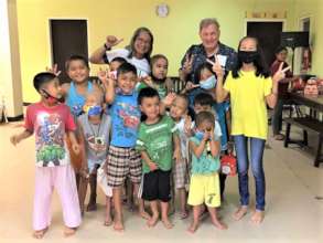 Pidot with children and AAI Director Santoli 2017