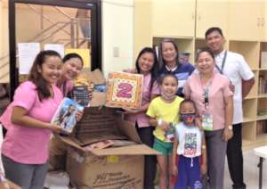 Pidot giving out books from AAI