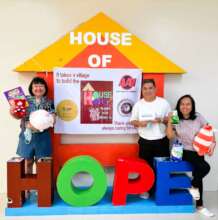 House of Hope volunteers with toys and books