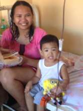 boy undergoing chemo with Mom and stuffed toy