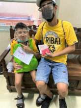 A dad and son receive Virtual Hugs of HOPE