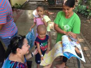 Fun reading Big Books with AAI and OWI volunteers