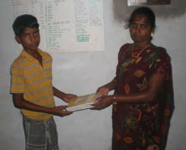 One student receiving books