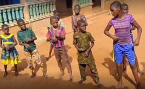 Children performing a dance during the visit.