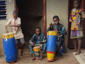 Children play instruments for the dancing.