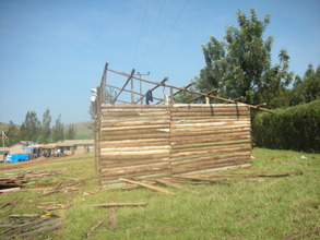The students help build the shelter.