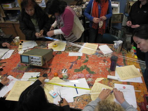 Teachers making resonator tubes