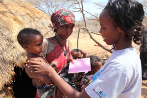 Sahara Aden receives a ration card for food.