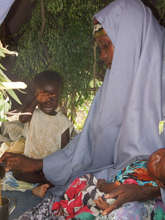 Maria Abdi with two of her children in Dhobley.