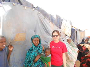 Amy and a family in the refugee camp