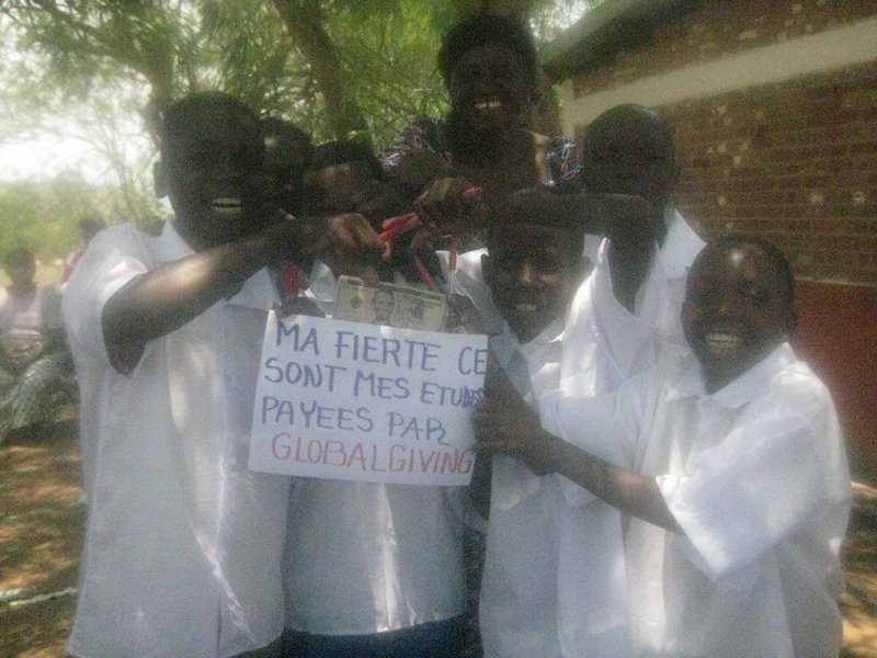 Sign: My pride is my studies, paid by GlobalGiving