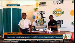 Dr. Picard Undendele conducting eye screenings.