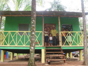 Nicaraguan Family in front of New Bamboo Home