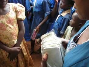 Children receiving school supplies