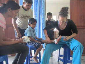 Volunteer Dr. Cranmer tends to young patient