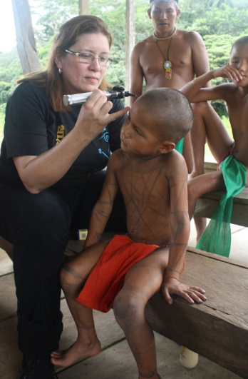 Dr Stella Rowley examining a little boy
