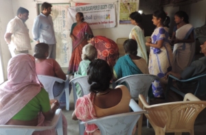 Mr.Veera Reddy with slum people during field visit