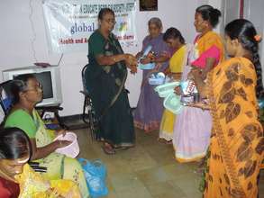 Dr.Prameelamma distributing drugs to LF patients