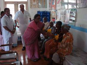 Dr.Prameelamma distributing drugs to LF patients