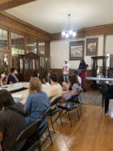 Antoine speaks to a group of volunteers