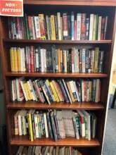 Photo of one of our office bookshelves