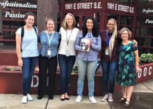 Author Elizabeth Acevedo (center) visits DC Jail