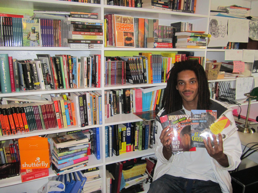 Sergio in the office with his favorite books