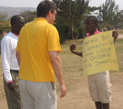 Johann Koss reads a welcome message from a child