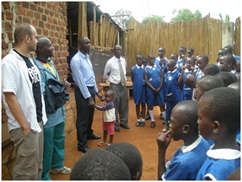 Anthony Scolaro (far left) visiting Uganda
