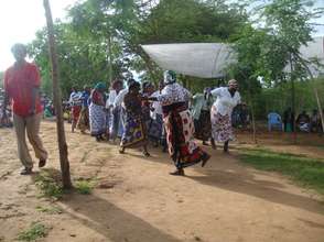 Farmers dance to celebrate after planting trees