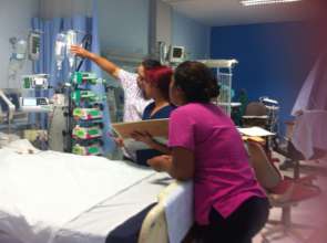 Nurse Ana Rosa tends to child