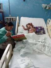 Little Angel, 4, is within reach of his mother.