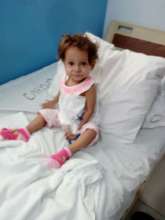Artenis, 16 months, is ready for her surgery.