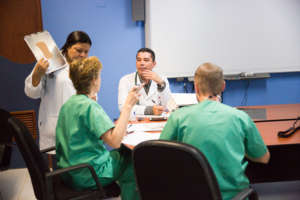 Dr. Katrien (2nd from left) discussing surgery.