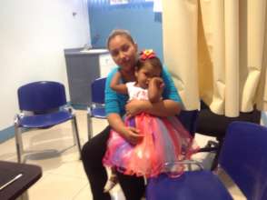 Adriana (2), from Managua, with her mother.